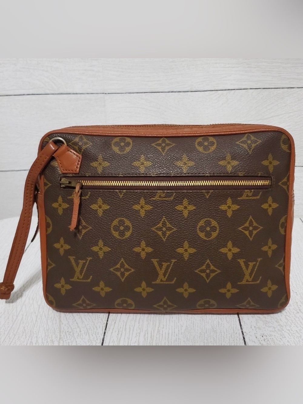 a vintage Louis Vuitton Pochette Sport clutch bag